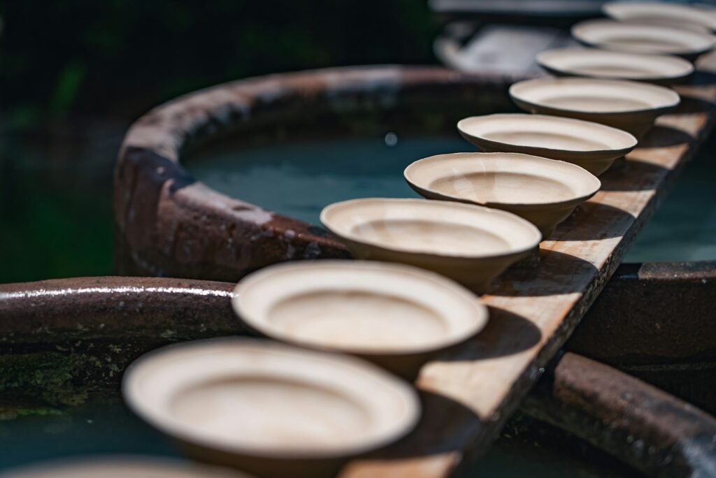 Rows of unfired ceramic ware on a production line