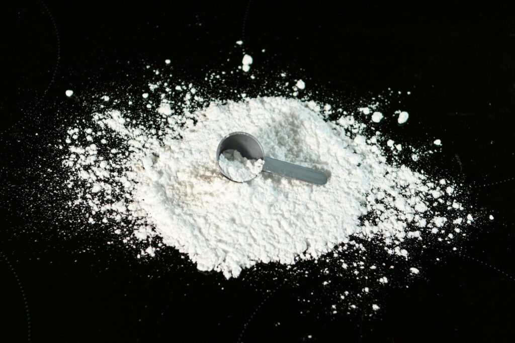 Fine white powder on a dark surface